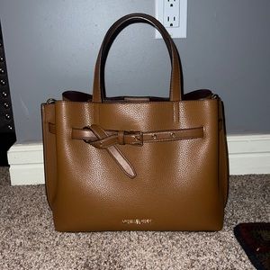 Michael Kors Emilia Large Pebbled Leather Satchel in brown.